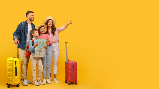 istock Family ready for vacation with luggage and map 2157066336