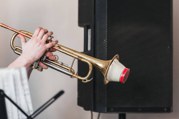 istock Trumpet with straight mute in trumpeter hands 2157067279