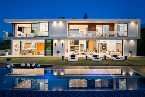 istock Spacious contemporary house illuminated at dusk 2157067769
