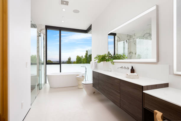 istock Spacious white bathroom with a sunny day view through the window 2157067806