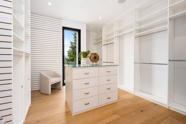 istock Wall-mounted storage unit with numerous cabinets and drawers, featuring a door 2157067818