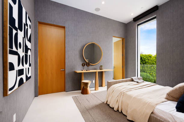 istock Spacious bedroom with a window and an exterior door 2157067831
