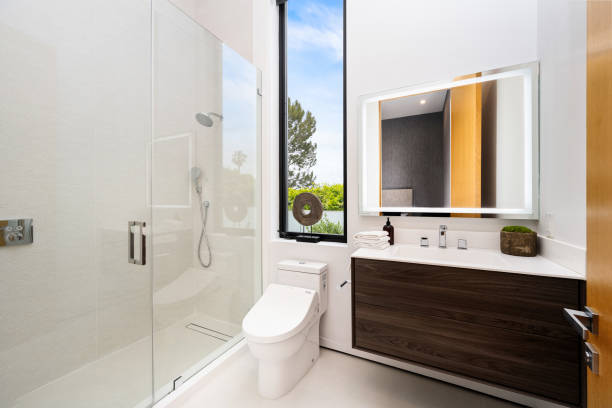 istock Contemporary, pristine bathroom with a mirror and a walk-in shower 2157067833