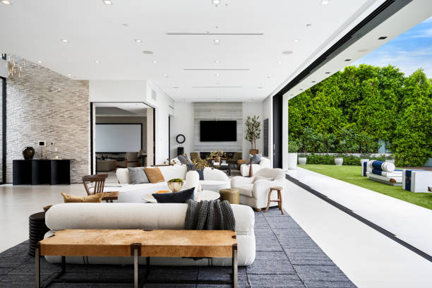 istock Spacious living room with elegant chairs and white couches 2157067874