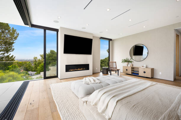 istock Modern, expansive Bedroom with a forest view through the window 2157067909