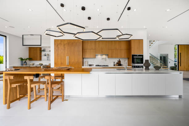 istock Modern kitchen with central island and two stools at the counter 2157067938