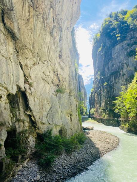 istock Tall, slender rocks tower above a river 2157071771
