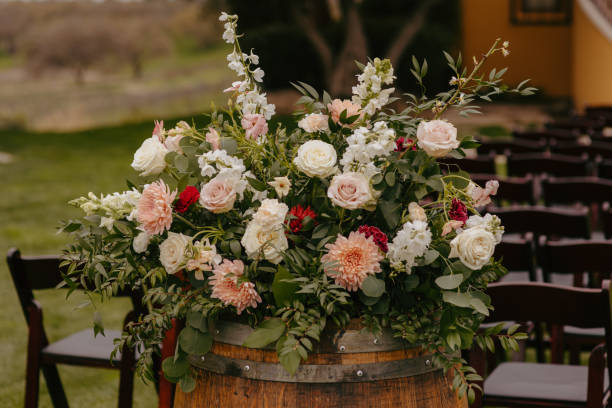 istock some flowers are on a barrel at an outdoor event setting 2157071881