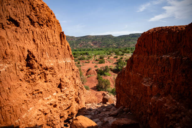 istock a view from the rocks looking down onto some hills and scrubs 2157072625