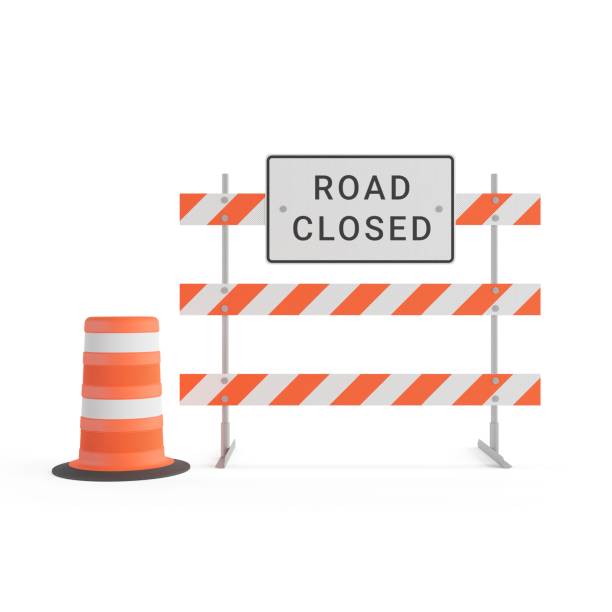 istock Road closed sign with orange traffic cones on white backdrop 2157073079