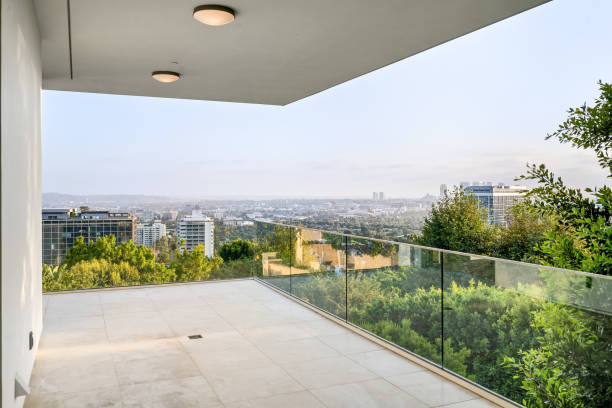 istock Balcony with city view, glass railing, and overhead lamp 2157074080