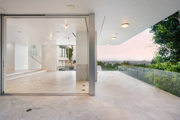 istock Modern white balcony with glass door and window above 2157074090