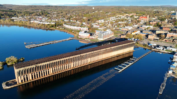 istock An aerial view of a large dock with arch structures with a cityscape and forests backdrop 2157074118