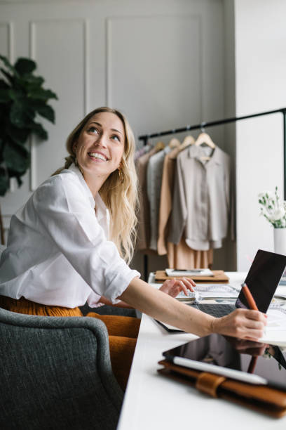 istock Young female designer in a boutique 2157074734