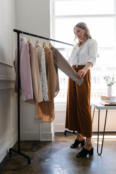 istock Young female designer in a boutique 2157074771