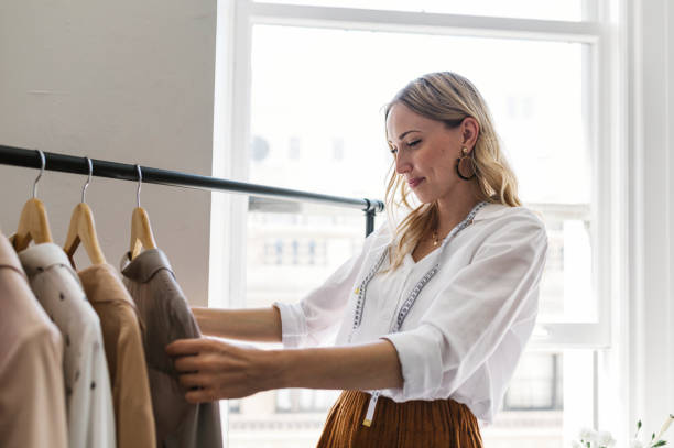 istock Young female designer in a boutique 2157074778
