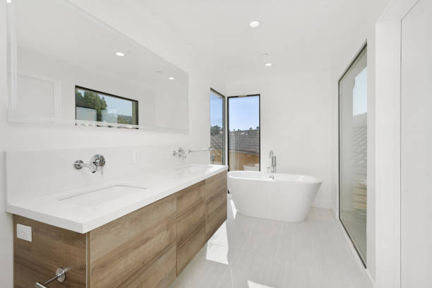 istock Bathroom featuring a bathtub, two sinks, and large windows. California, USA 2157074809
