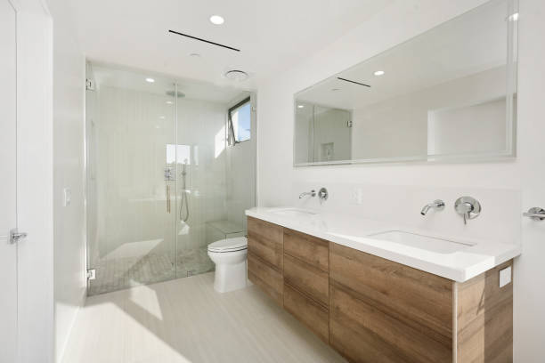istock Modern and airy bathroom with illuminated light and a large mirror. California, USA 2157074811