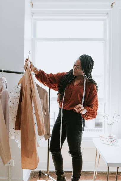 istock Young female designer in a boutique 2157074900