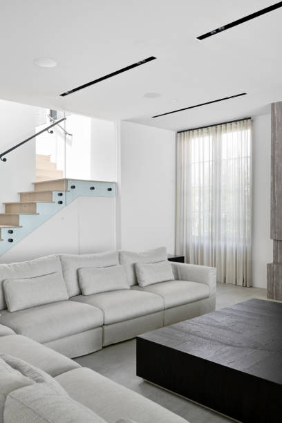istock Spacious sectional sofa with a staircase in the background 2157074943