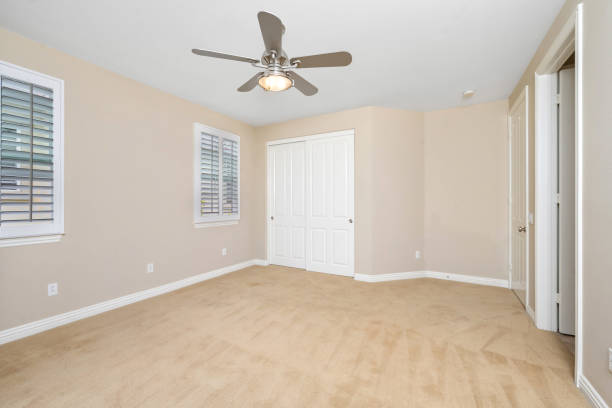 istock Room featuring windows with white blinds and a ceiling fan. California, USA 2157074984