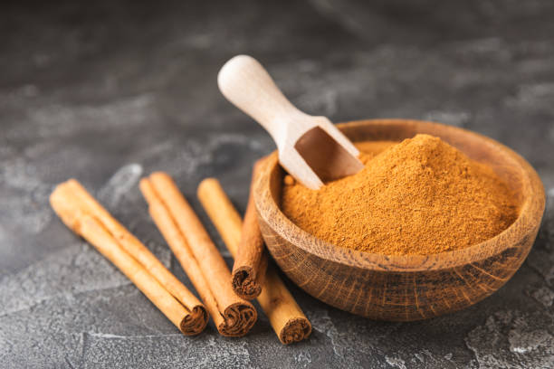 istock Ceylon cinnamon.Cinnamon sticks on a textured wooden background. Cinnamon roll and powder. Spicy spice for baking, desserts and drinks. Fragrant ground cinnamon. Close-up. Place for text. copy space 2157076781