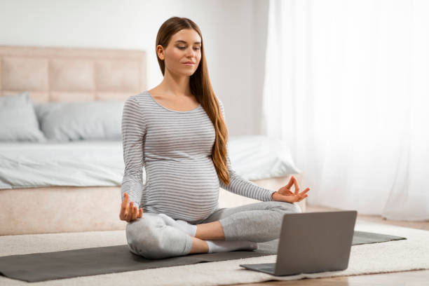 istock Pregnant woman using laptop for prenatal classes 2157077780