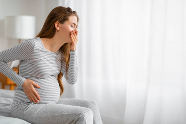 istock Pregnant woman feeling unwell on bed 2157077783