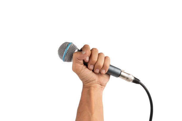 istock Black male hand holding a microphone isolated on white background 2157078256