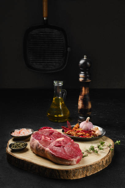 istock Raw fresh lamb center cut leg steak with spice on the kitchen table 2157078952