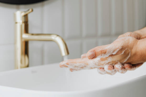 istock Man washing his hands with soap 2157079477