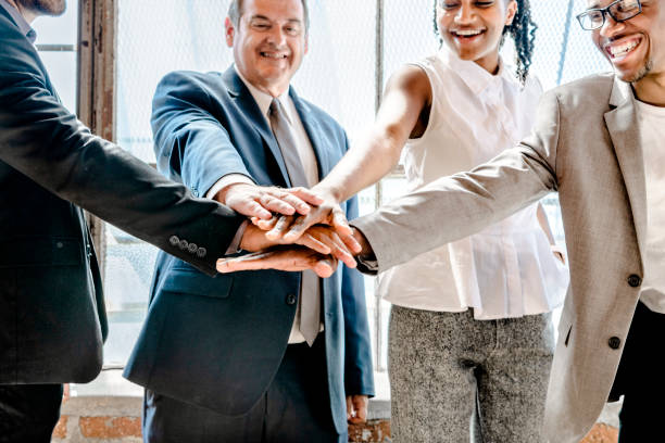 istock Group of diverse people stacking hands in the middle 2157080080