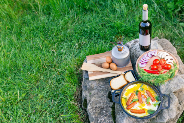 istock Cooking food in a frying pan while camping. 2157080318