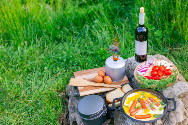 istock Cooking food in a frying pan while camping. 2157080327