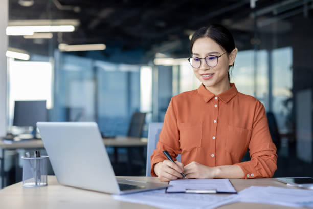 istock Professional woman working happily in a modern office 2157080618