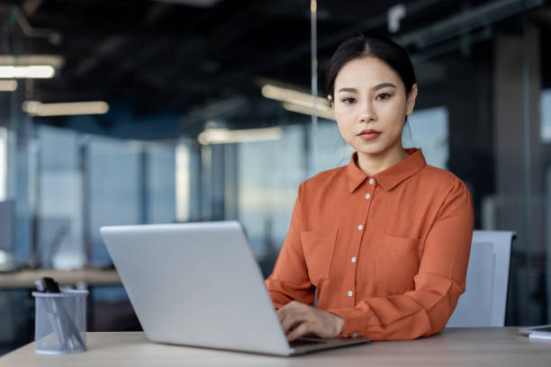 istock Serious Asian businesswoman contemplating while working in a modern office 2157081396