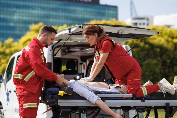 istock Emergency paramedics performing CPR on patient outdoors 2157081464