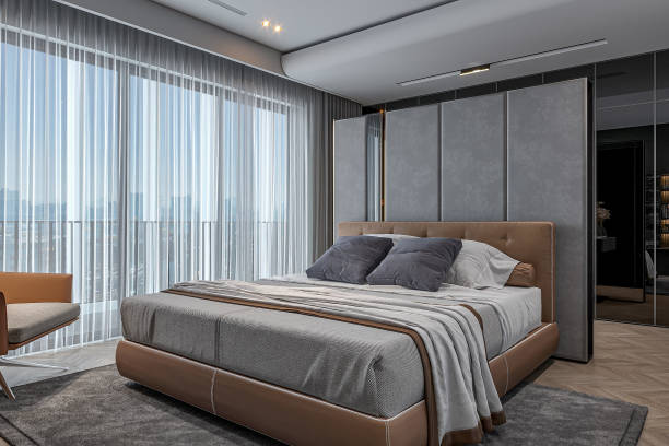 istock The Stylish interior of a comfortable bedroom, with a large window. 2157081574
