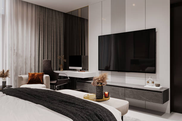 istock Modern bedroom with a cozy bed, and mounted TV 2157081749