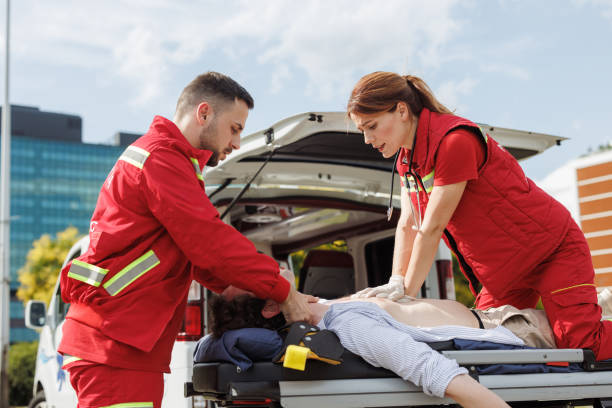 istock Paramedics performing CPR on patient at emergency scene 2157081799
