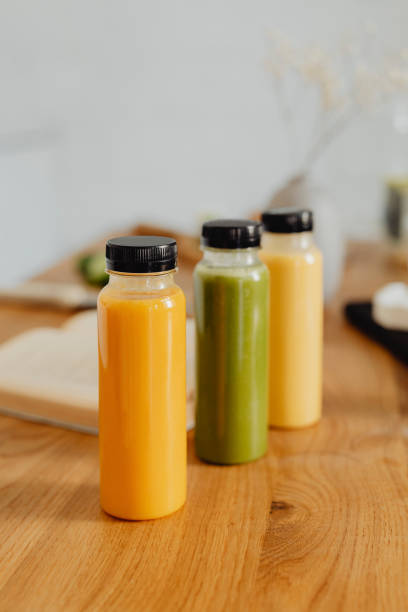 istock Homemade freshly squeezed juice in bottles on a table 2157082488