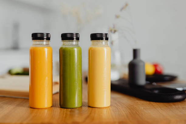 istock Homemade freshly squeezed juice in bottles on a table 2157082491