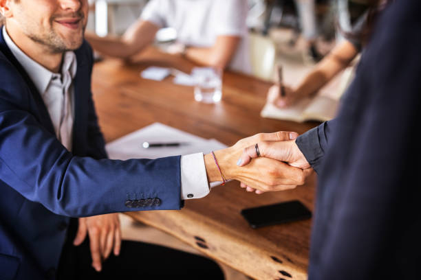 istock Business people shaking hands in agreement 2157082886