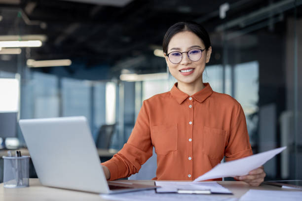 istock Professional businesswoman with documents in modern office 2157082985
