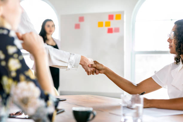 istock Business people shaking hands in agreement 2157083003