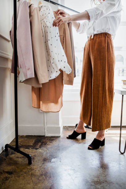 istock Young female designer in a boutique 2157083625