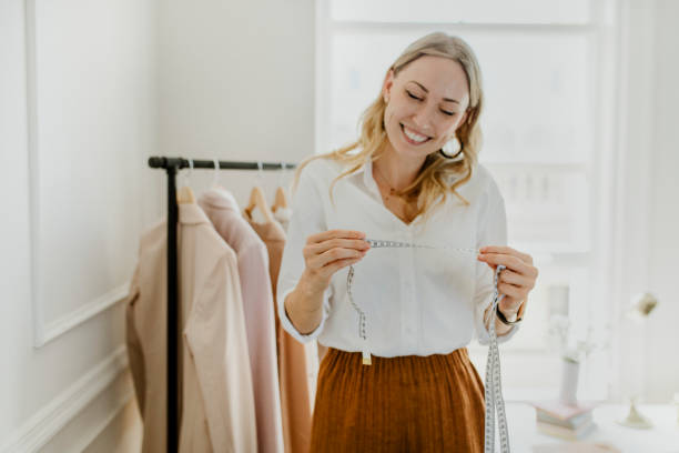 istock Young female designer in a boutique 2157083677