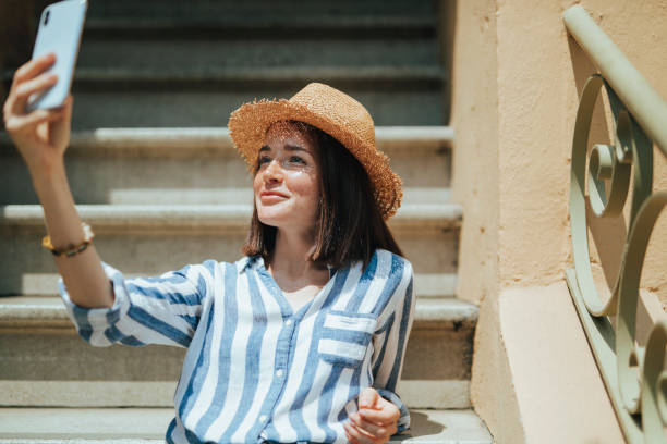 istock Woman taking a selfie at a stairway 2157084698