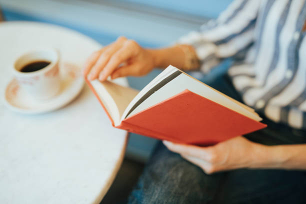 istock Closeup of a woman reading a book 2157084781