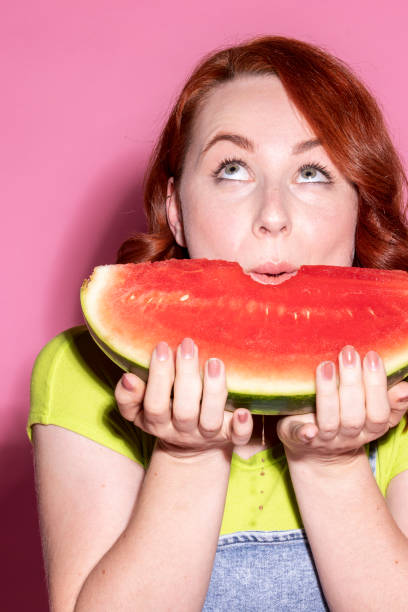 istock Woman with a slice of watermelon 2157087792